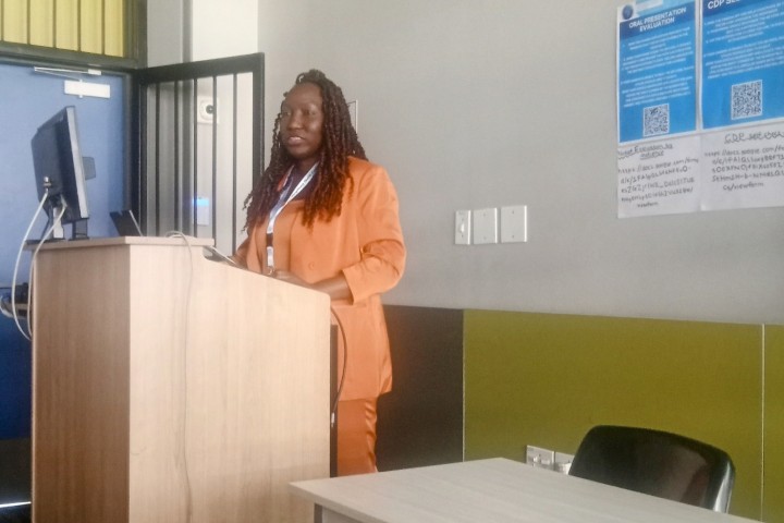 Dr. Smiley speaking at a podium